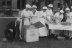 Women canning food outside