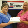 iPad being presented to Donna Teasley