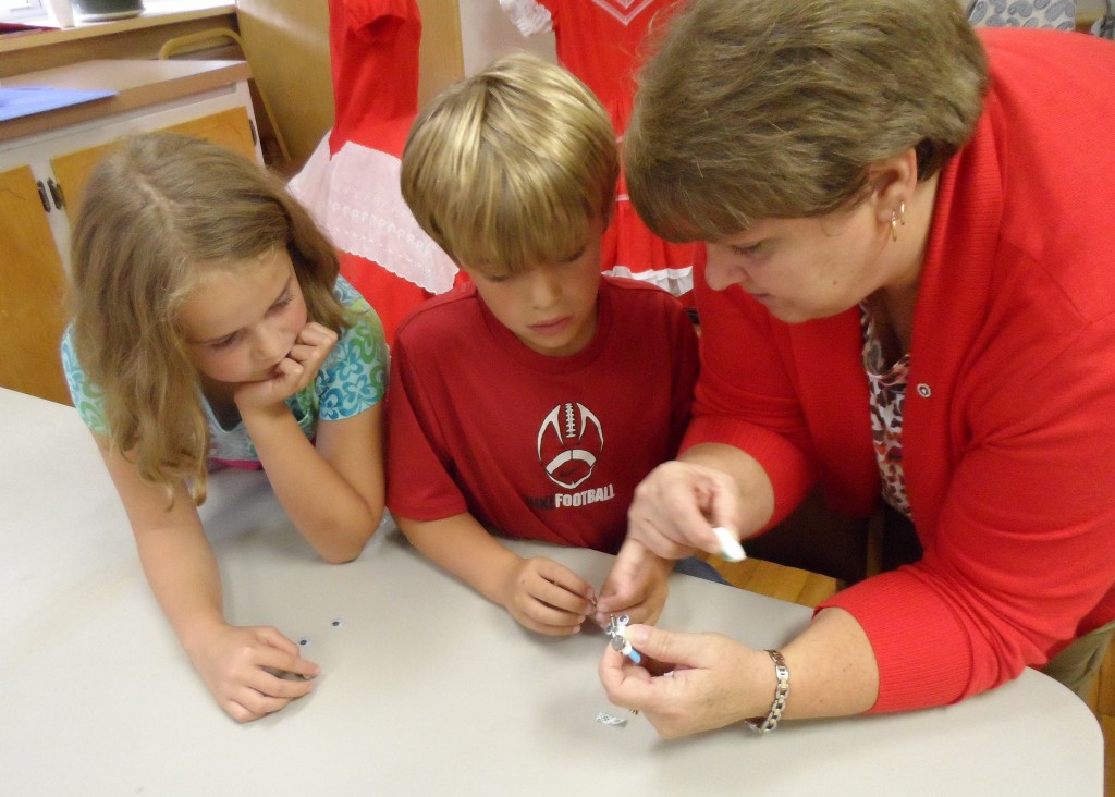 2012 4-Hers and volunteer instructor, design their Eco-Bot for 4-H National Science Day.