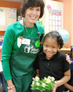 Master Gardener and student with pansy plants.