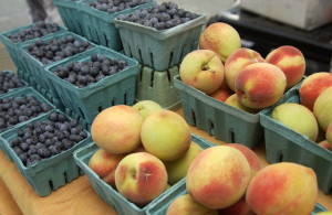 Market stand with peaches and blueberries