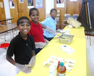 Students making a cabbage slaw