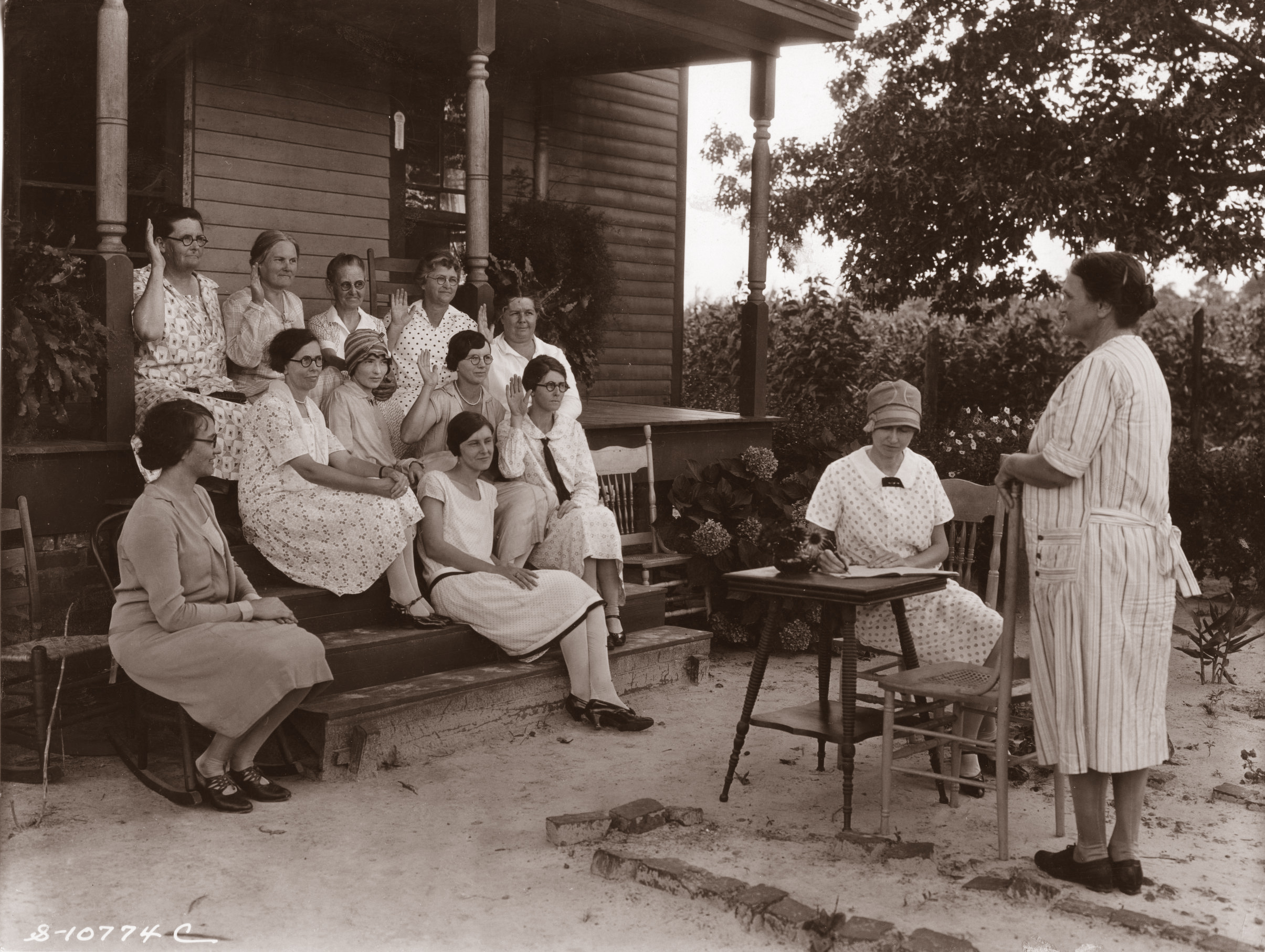 Mrs. Joe Kelly presides at the Watha Home Demonstration Club meeting. The picture, set in rural Pender County, was probably taken between 1925 and 1930.