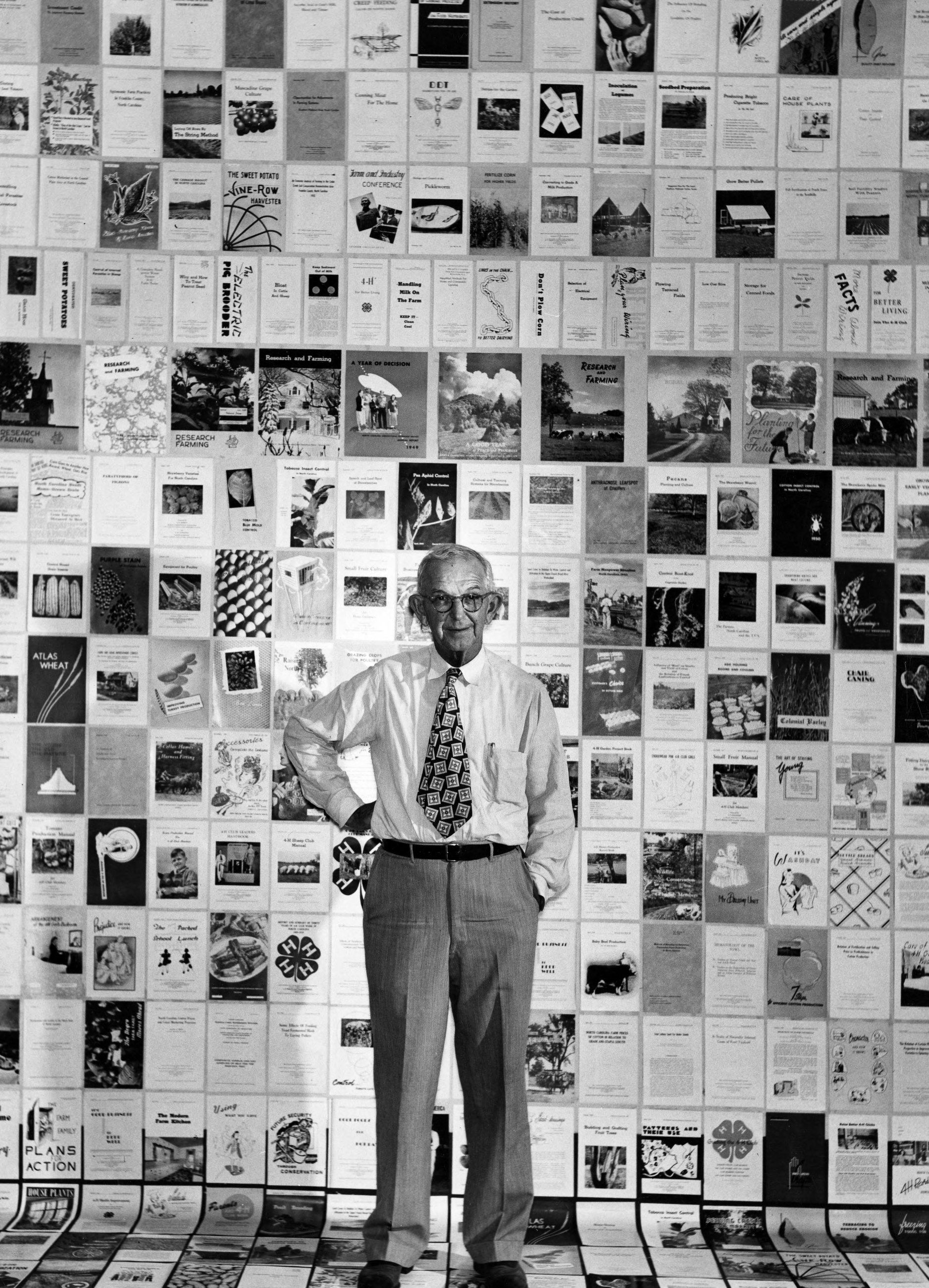 Ira O. Schaub, surrounded by extension publications near the time of his 1950 retirement as director of what was then known as the North Carolina Agricultural Extension Service.