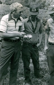 (L - R) NCSU Extension Agent Donald Bunn, Laney Dehart (center) and Larry Mashburn discussing tomatoes.