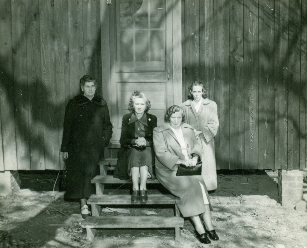 Swain County's 4-H cabin at Camp Seloub Waynesville. L-R Mrs. Eva McHan, Mrs. Fairie Moore, Mrs. Lula Bates, Mrs. Glennie Roberts
