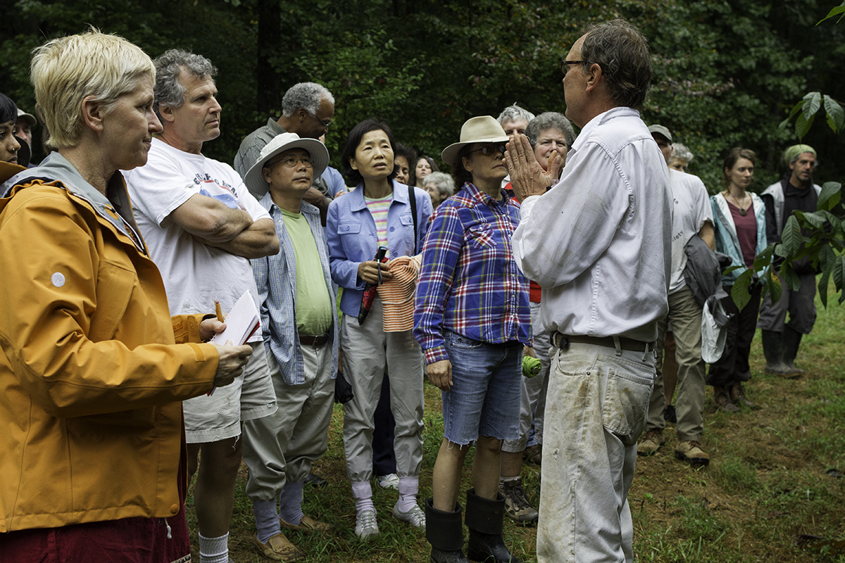 Folks gathered in the orchard to learn from grower Wynn Dinnsen.