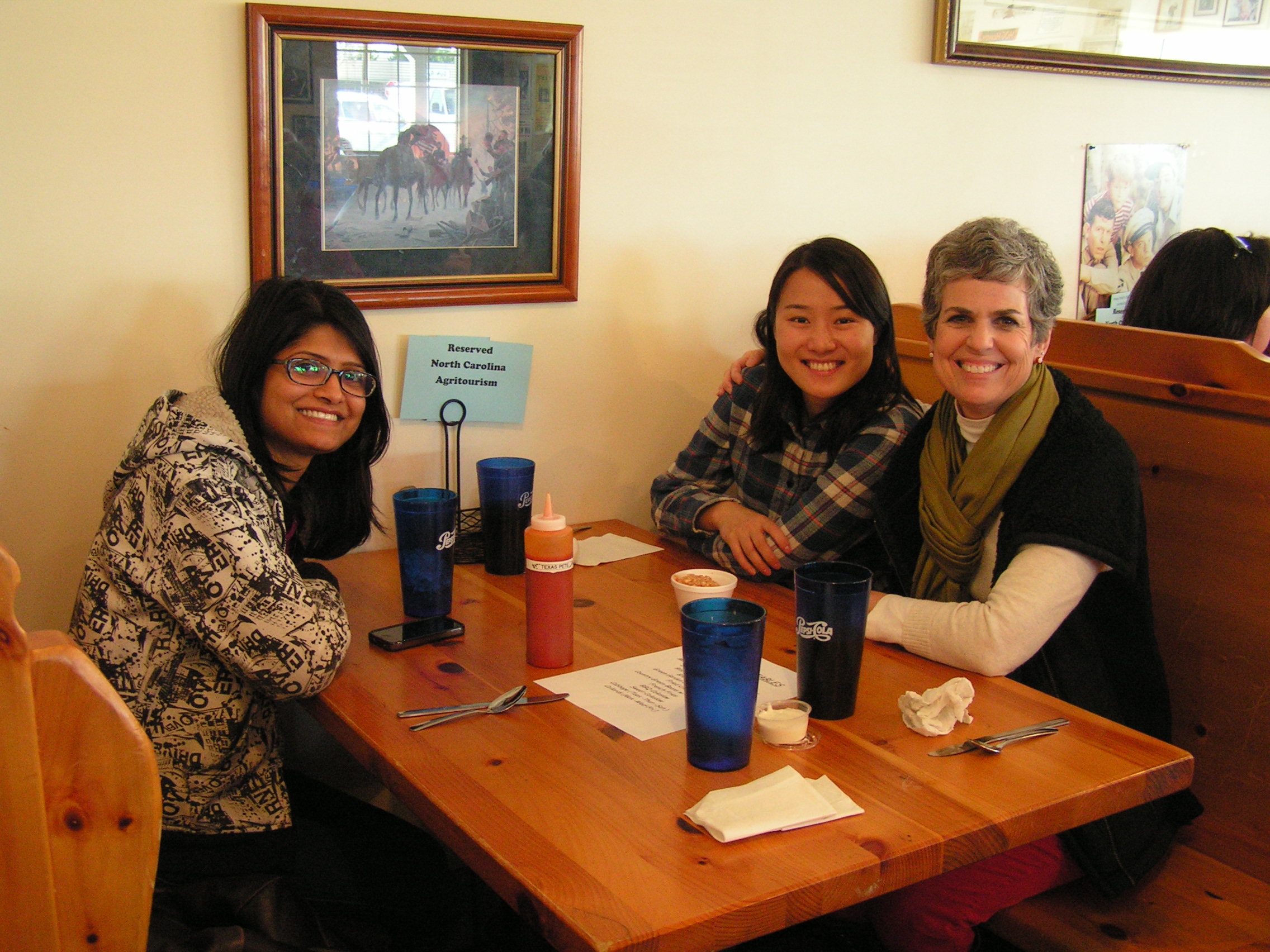 Mirza (left), Jing (far-right) talking about current and future agritourism opportunities with Annie Baggett, Agritourism Marketing Specialist (NC Department of Agriculture & Consumer Services). 