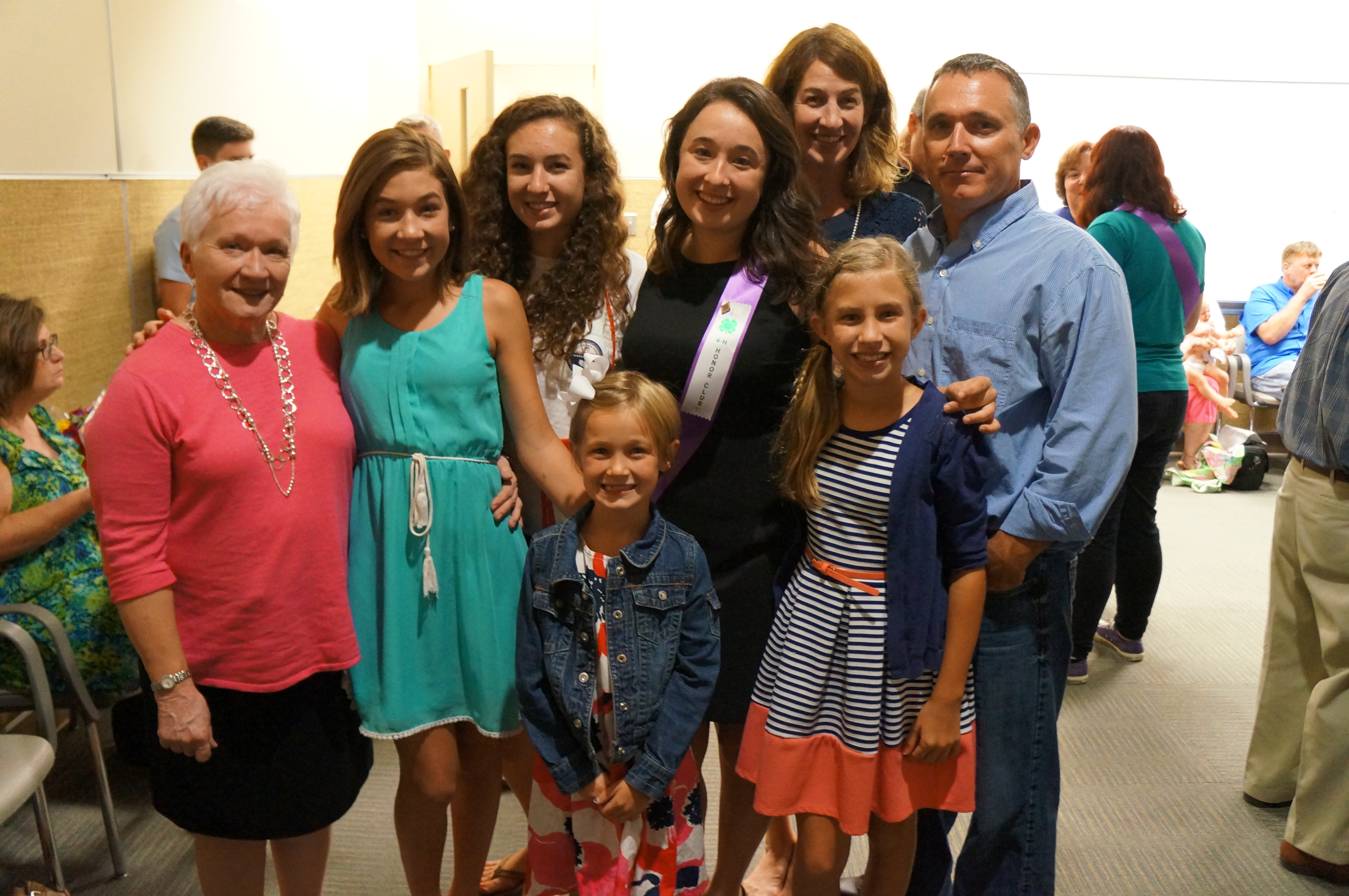 The Glass family, Doris, Rodney, Karen, Reagan, Sarah, Maggie, and Ruth Ann Glass, pose with new 4-H Honor Club inductee, Audrey Glass.