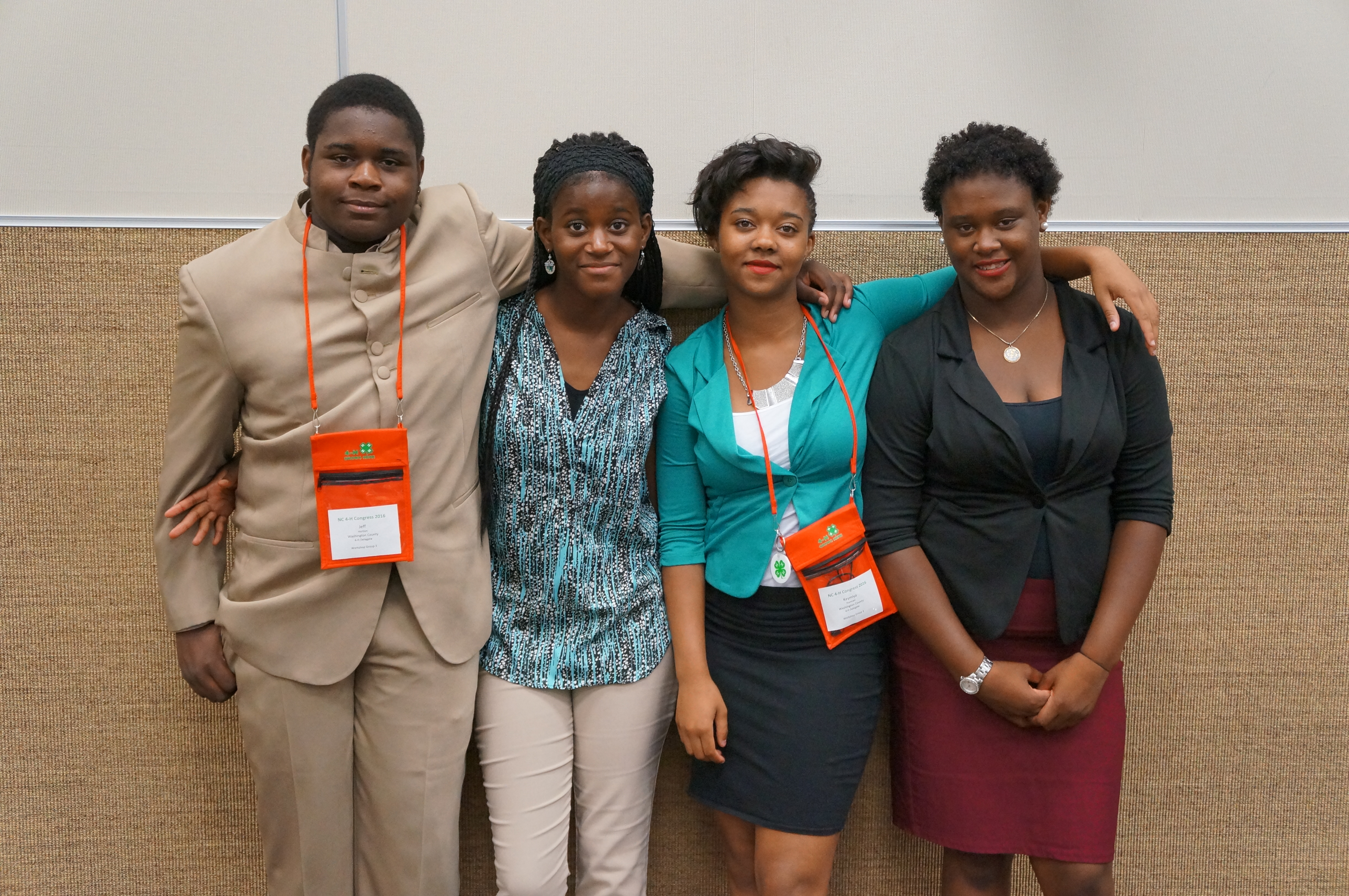 4-H Application, Interview, Resume, Essay contest participants Jeff and Marisa Horton, and Keymiya and Keyaria Norman pause for a photo after their interview contest.