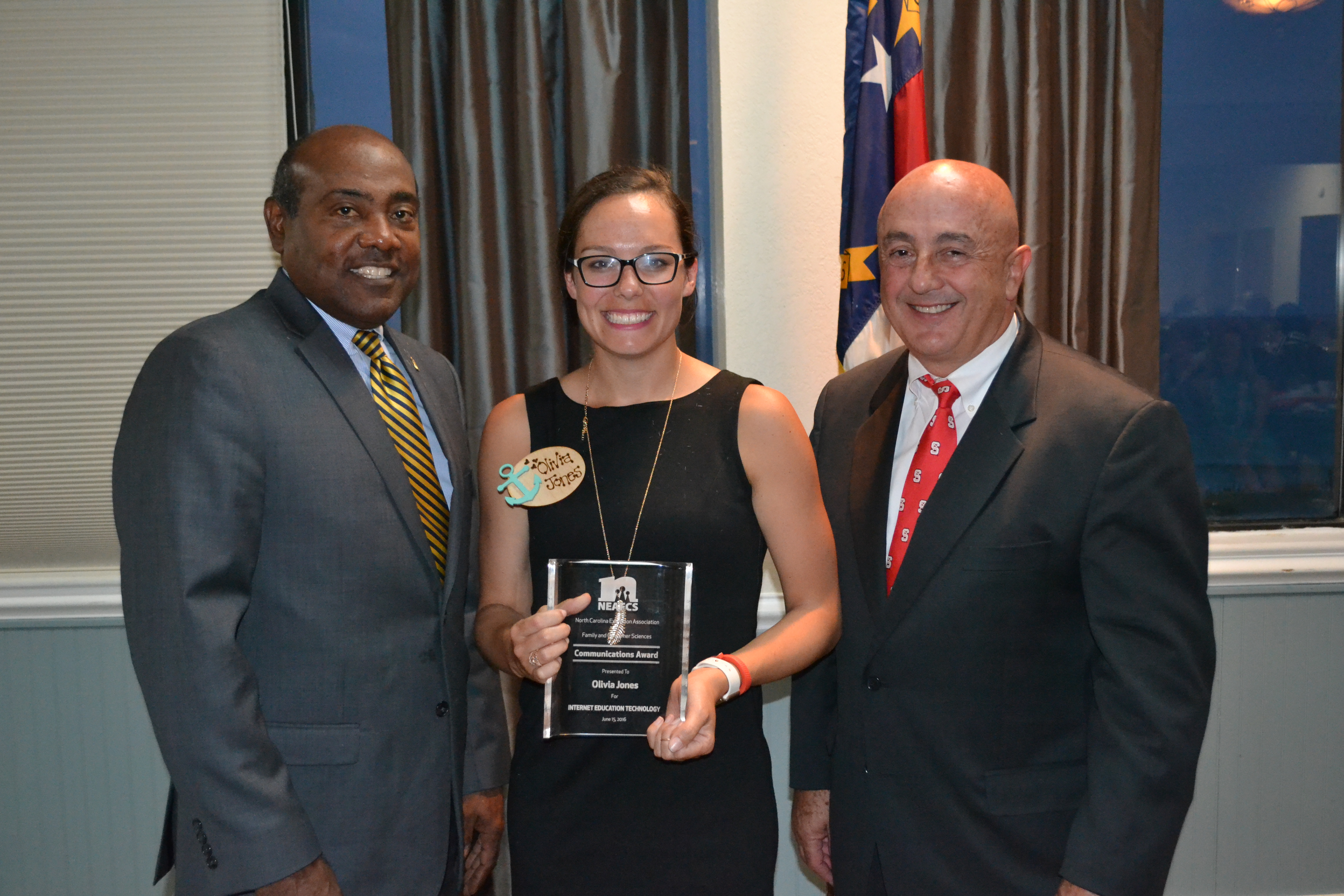 Dr. Fletcher Barber (left) and Dr. Rich Bonanno (right) presenting award to Olivia Jones (center)