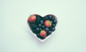 Heart shaped bowl full of berries