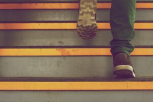 Close up of a person's feet who are walking up steps