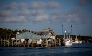 Boat waiting at a dock that is on water