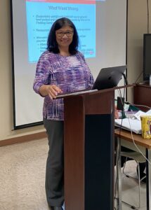 Lady at podium teaching class