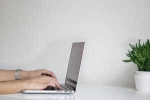 typing on computer at desk