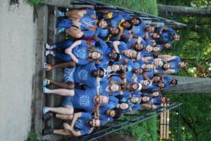 group of camp employees sitting on steps