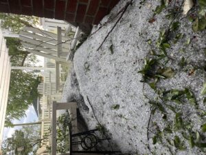 Hail falling from a roof line in Pitt County, NC.