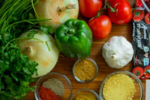 vegetables, herbs, and spices on cutting board