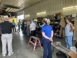 The Virginia tour group in farmer's shop.