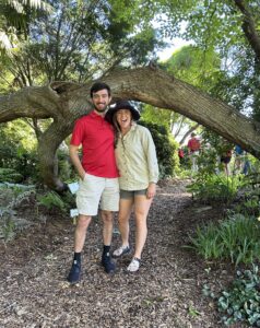 INtern Tanner Collier and Agent Sarah Christas standing in front of tree