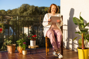 person with an iPad outdoors