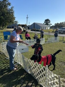 Luke Morris and his canine companion, Scout receiving their 2nd place ribbon