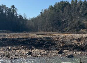 A farm field showing eroded streambanks and flood deposits.