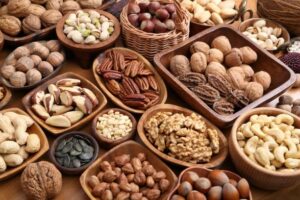 A variety of nuts in wooden bowls. Healthy food.
