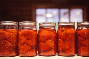 row of canned tomatoes