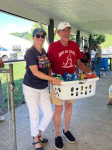 Teacher receives basket of school supplies