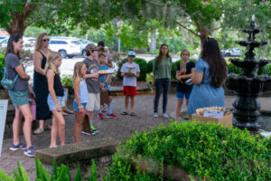 Gabriella teaching youth participants the key elements to field journaling.